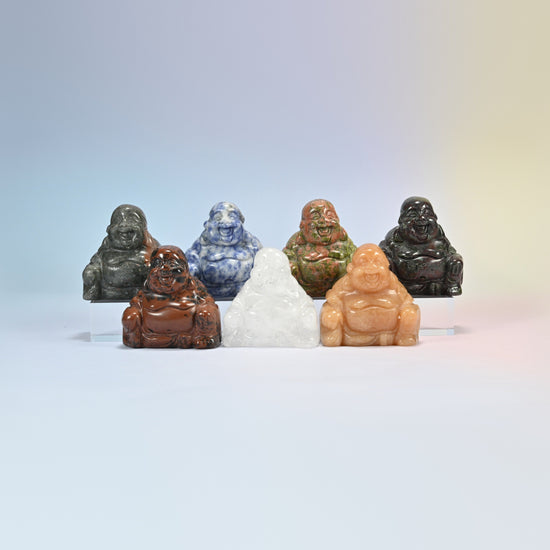 Group of laughing Buddha crystal carvings in black obsidian, blue spot jasper, unakite, golden swan, clear quartz, red aventurine and dragon bloodstone
