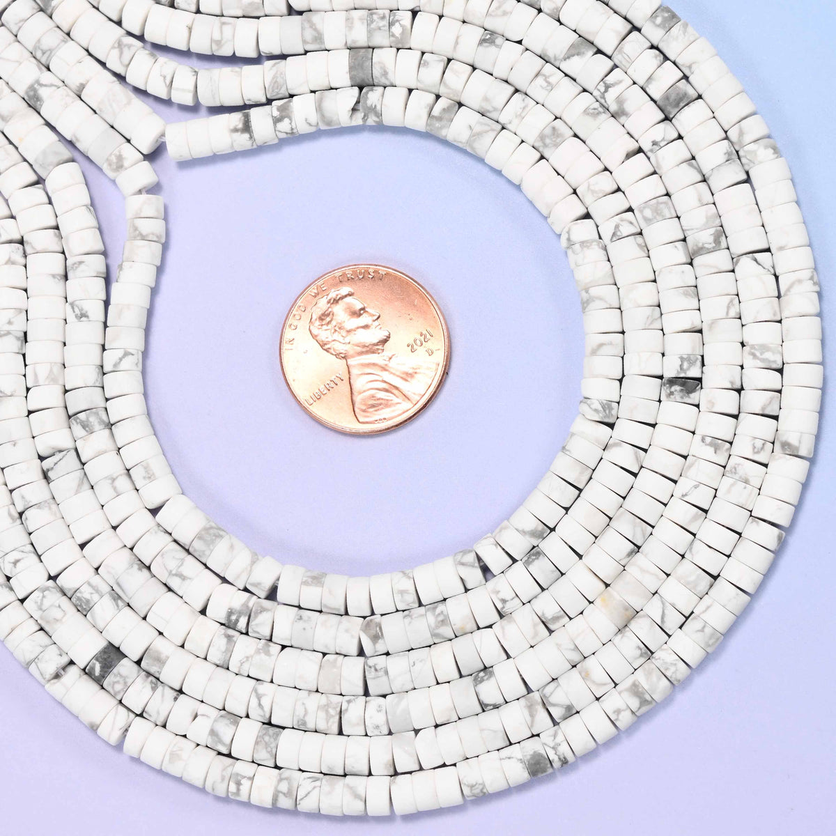 Natural white howlite matte heishi disc beads in soft white with subtle grey veining.