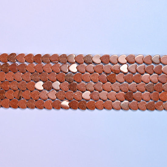 Gold Sandstone Flat Heart Beads in warm copper brown with metallic flecks