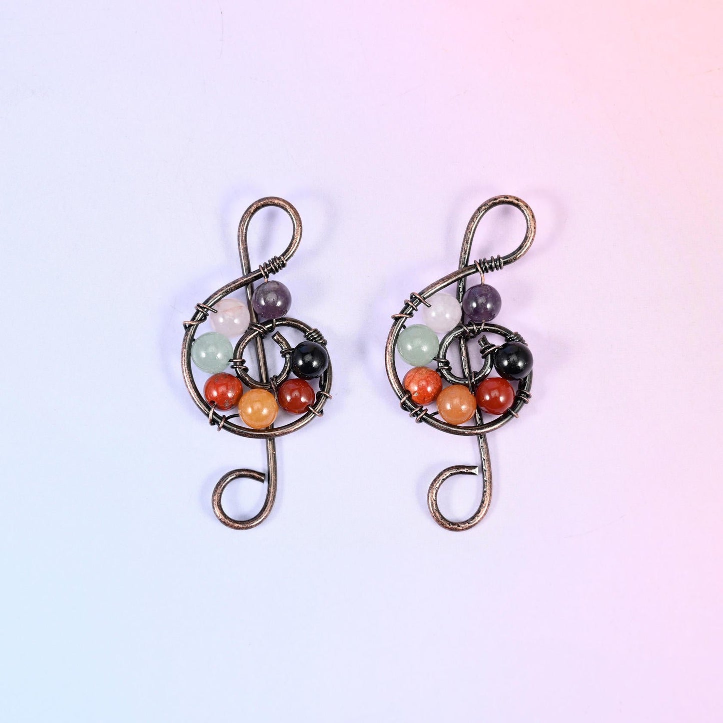 Treble Clef Music Symbol Pendant, brass wire bent into a treble clef wound around a cluster of 6mm gemstone rounds