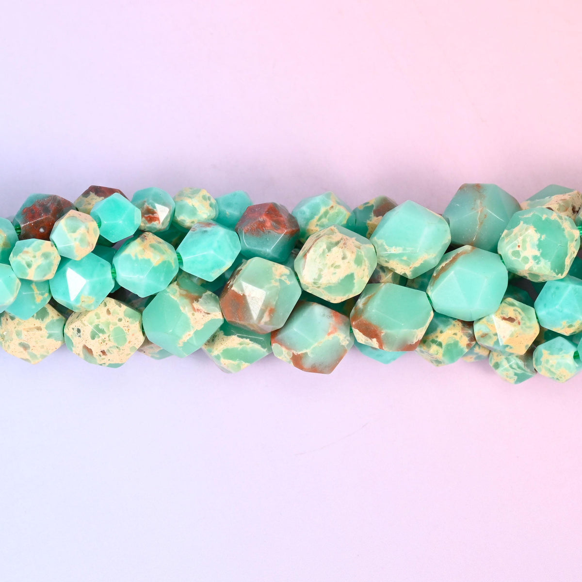 Green Shoushan Stone gemstone beads with natural webbing and a faceted star cut