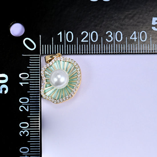 18K Gold Plated Brass Shell Pearl Charm Pendant with a ribbed mint green enamel shell, a faux pearl center, and a sparkling clear zircon border