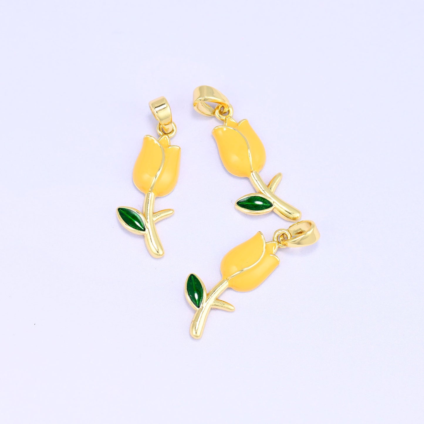 Enamel tulip charms in yellow, 18K gold plated brass with green enamel leaf, three 22.08 x 8.60mm flower pendants