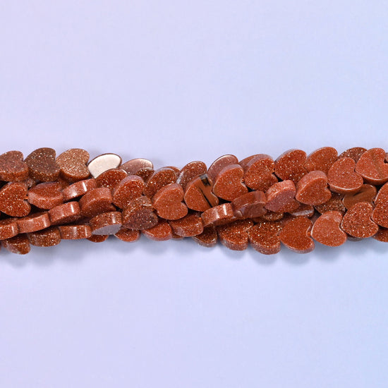 Gold Sandstone Flat Heart Beads, approximately 68 beads per strand