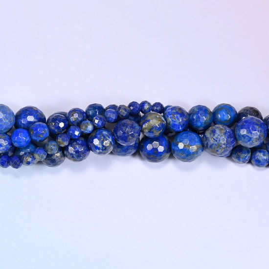 Lapis Lazuli faceted beads with a polished faceted finish that catches the light.