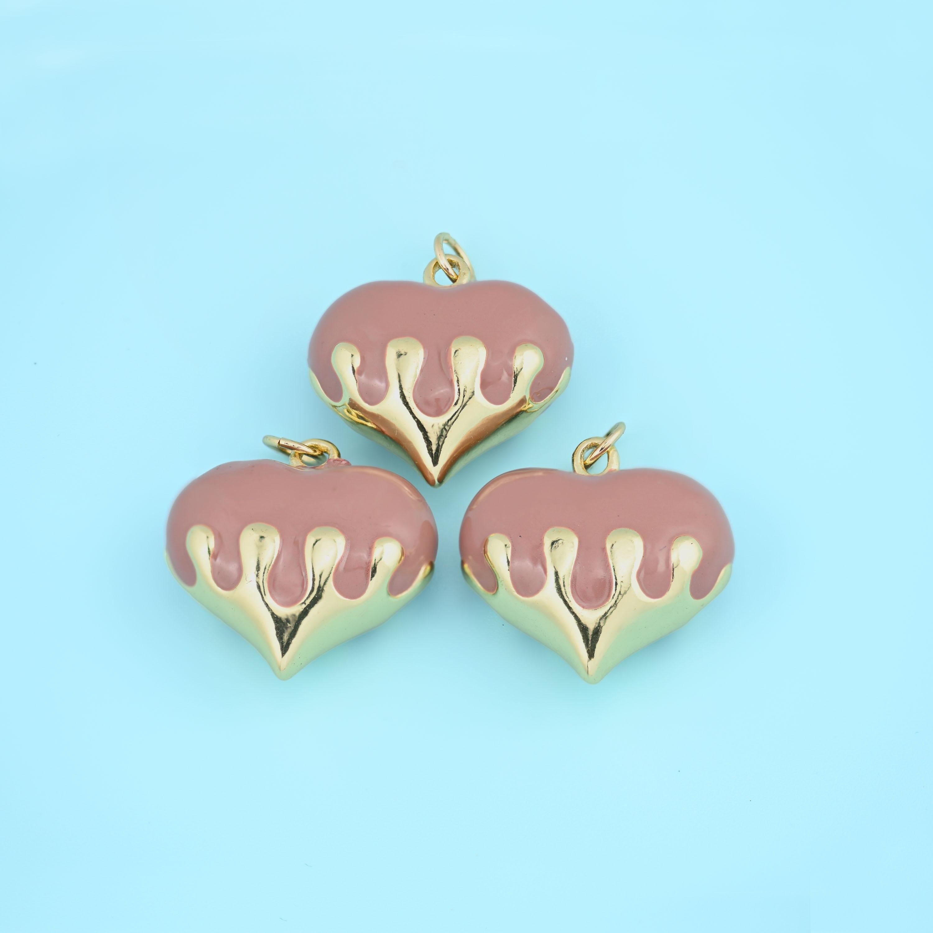 Enamel dripping puffy heart pendant in mauve, three pieces in dusty rose enamel with polished gold drips.