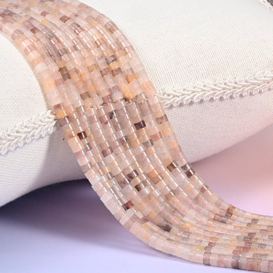 Natural Lavender Quartz smooth heishi disc beads in soft peachy-pink and cream tones