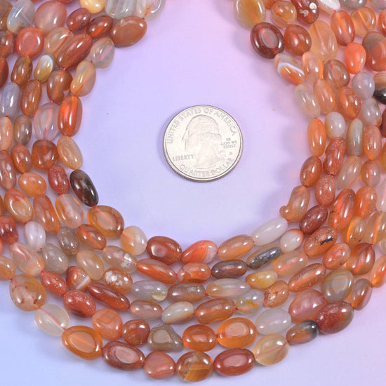 Red Botswana agate pebble nugget beads, approximately 40 beads per strand