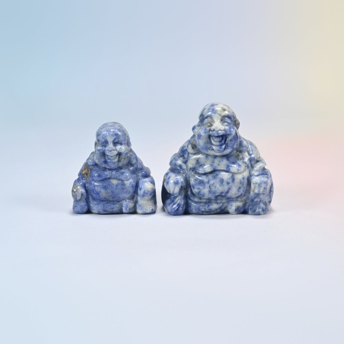 A 1.5 inch and a 2 inch blue spot jasper laughing Buddha crystal carving, white natural stone with blue spots