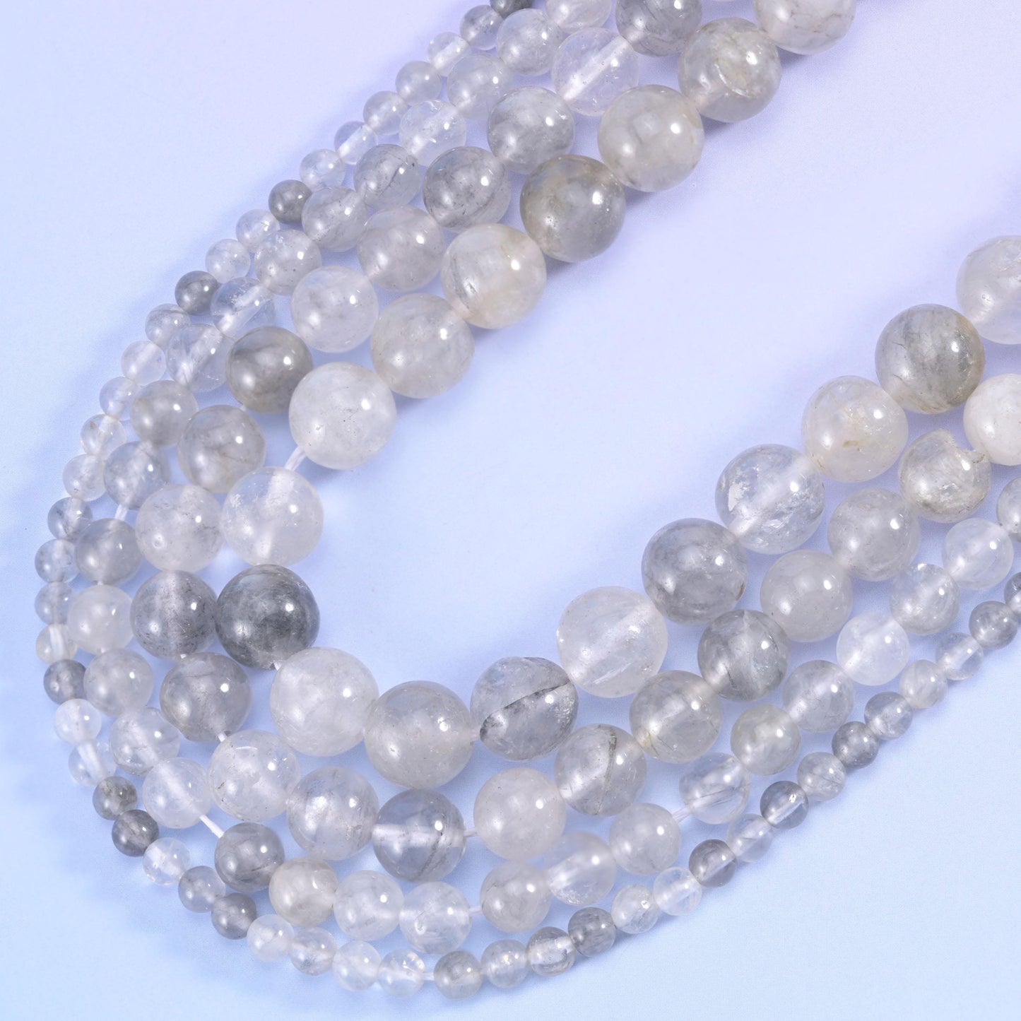 Smooth round cut cloudy quartz beads