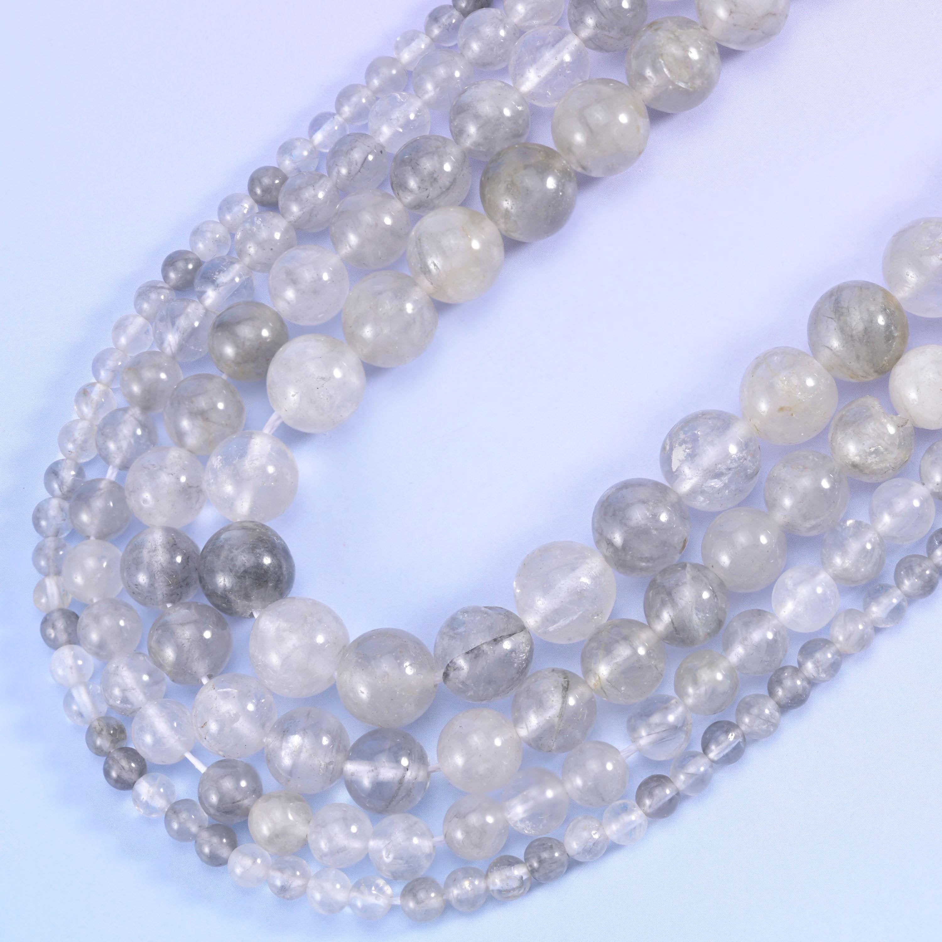 Smooth round cut cloudy quartz beads
