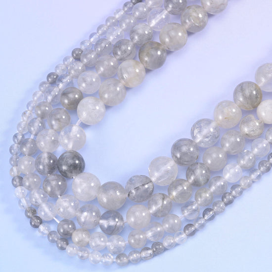 Smooth round cut cloudy quartz beads