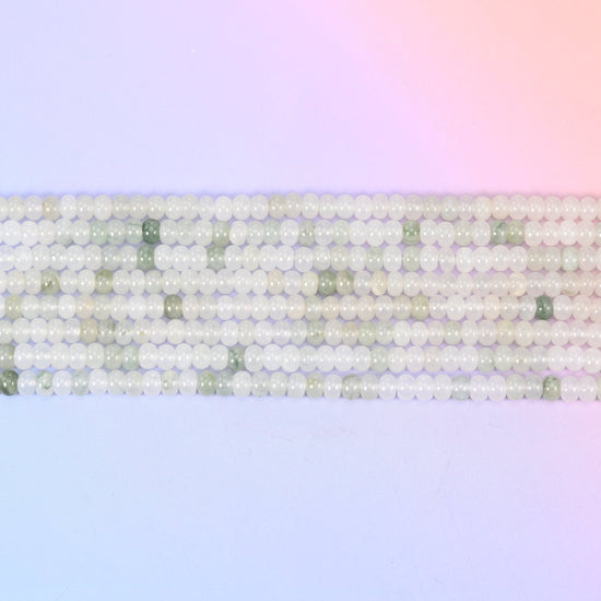 Tianshan Jade Smooth Rondelle Beads in soft milky white with sage-green accents