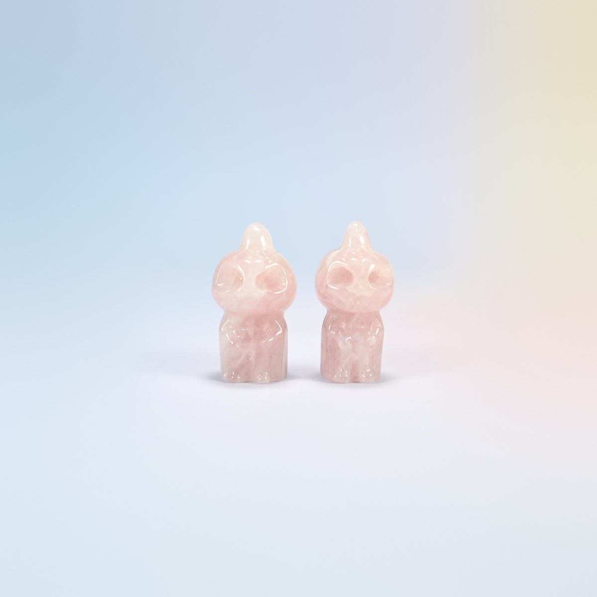 Two natural rose quartz pumpkin skull carvings in light pink, 1.8 inch