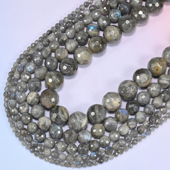 Gray Labradorite faceted round beads curving in a wide loop, white and tan streaking falling differently on every bead