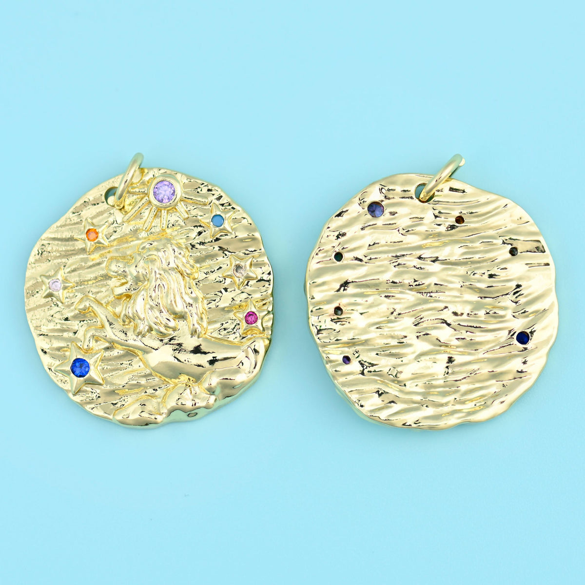 18K gold plated zodiac pendant with a reclining figure motif, shown front and back