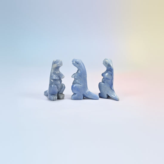 Three blue aventurine T-Rex dinosaur crystal carvings, 2 inch, soft blue natural stone with fine sparkle