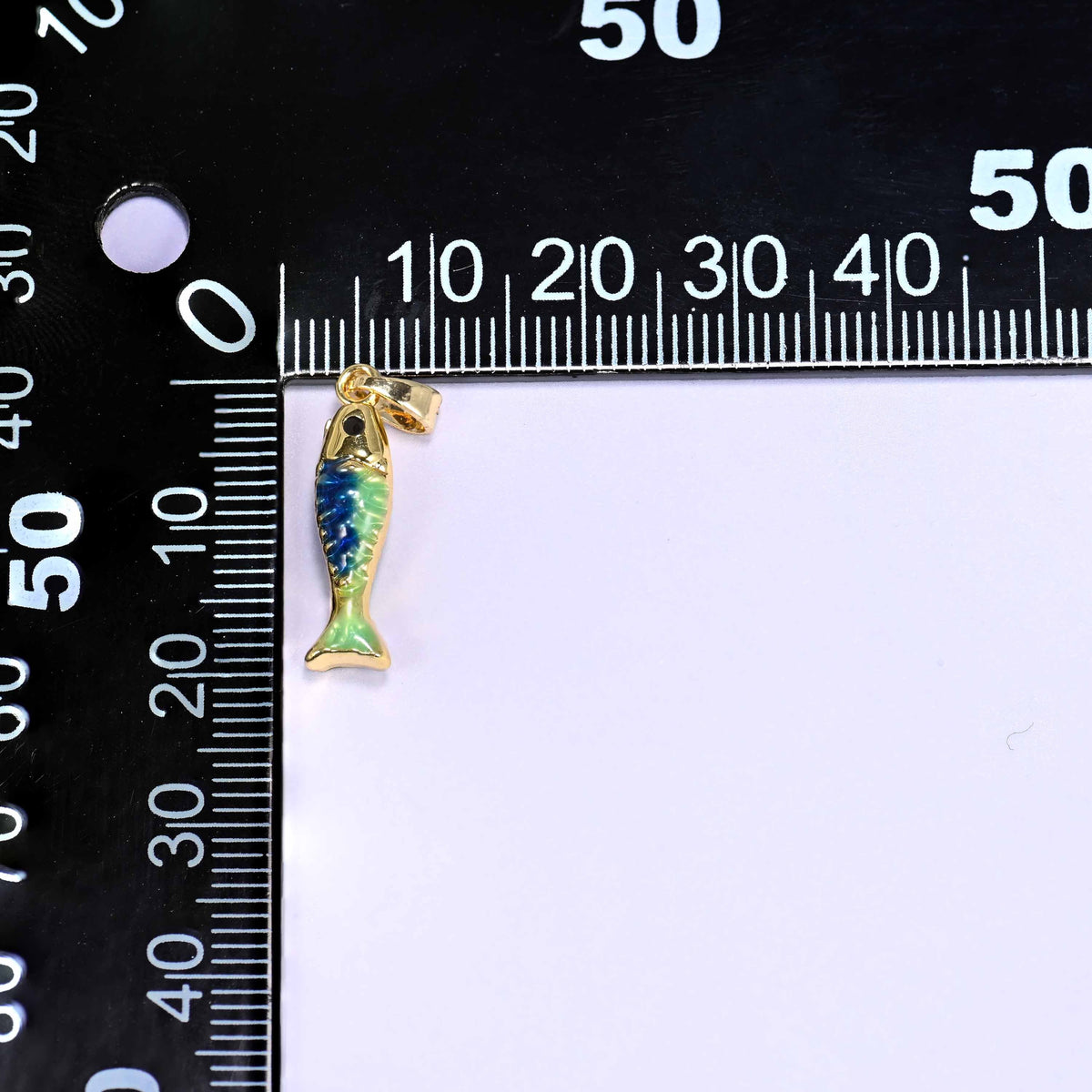18K gold plated brass fish charm pendant with a textured scale body in blue and green enamel and a glossy gold tail and fins.