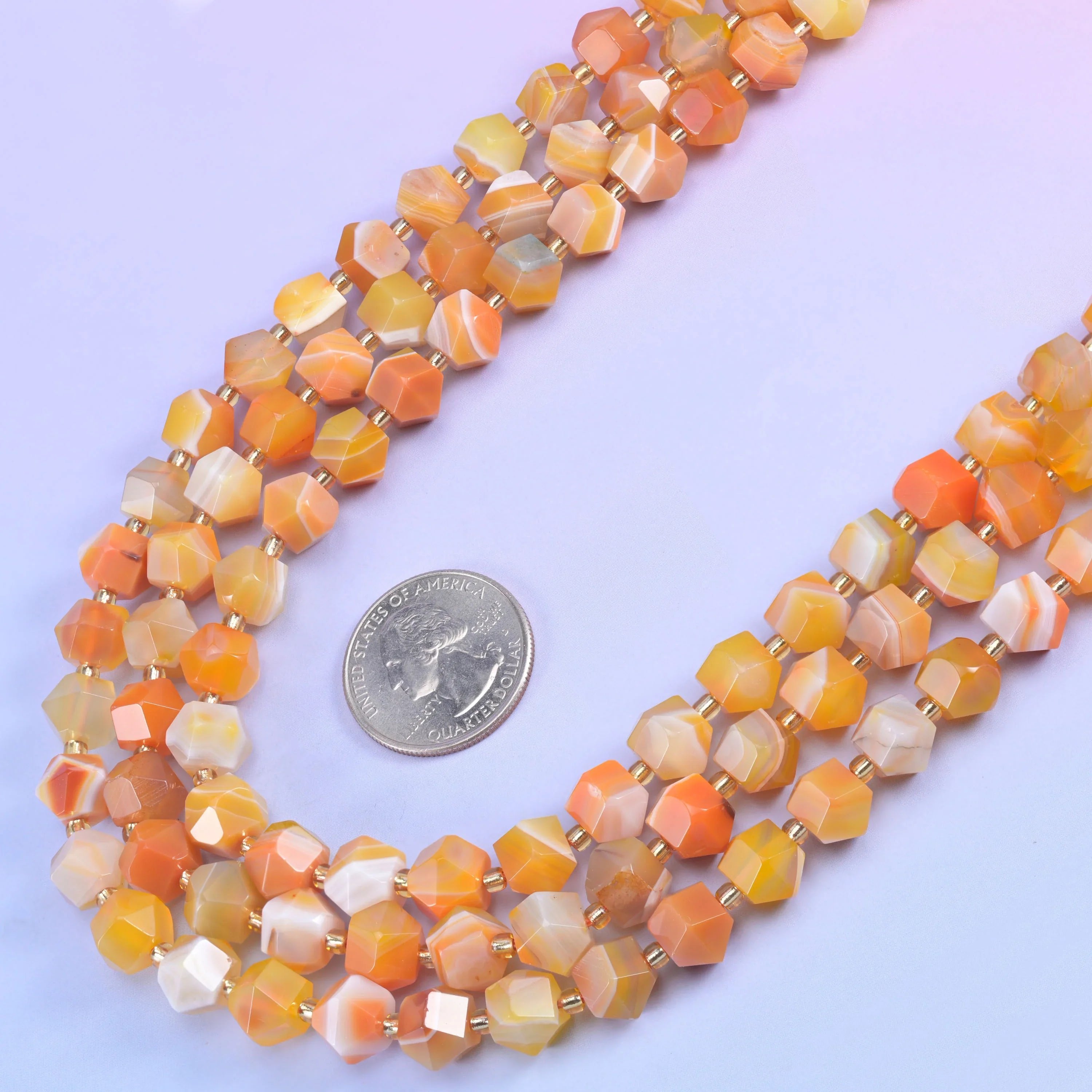 Eight flat sides cut into a sharp rhombus, so every bead throws light from a different angle instead of one soft highlight.…