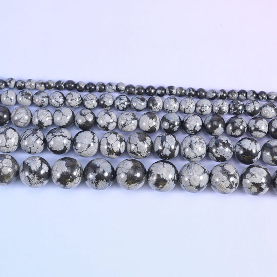 Snowflake jasper round beads in charcoal and near-black with white markings