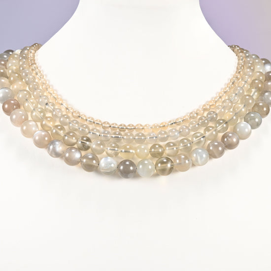 AAA Gray Labradorite smooth round beads layered as a collar, several strands showing the 4mm through 10mm sizes