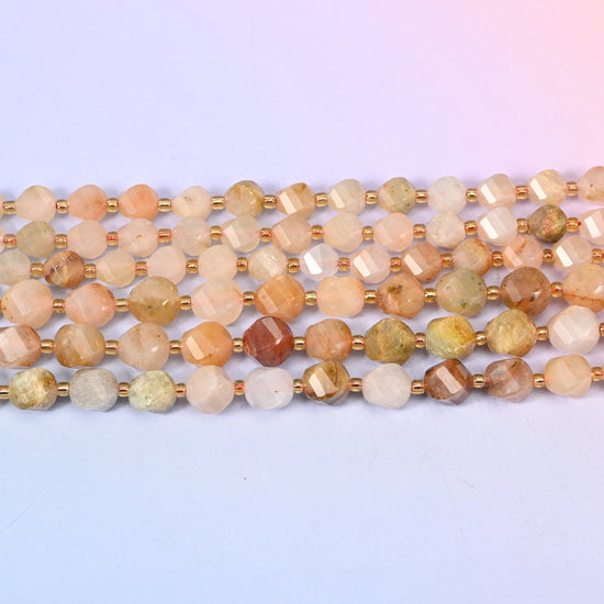 Red Grass Silk Stone beads in soft peach and apricot drifting into oatmeal cream