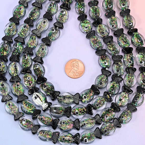 Fish shaped iridescent black green glass beads