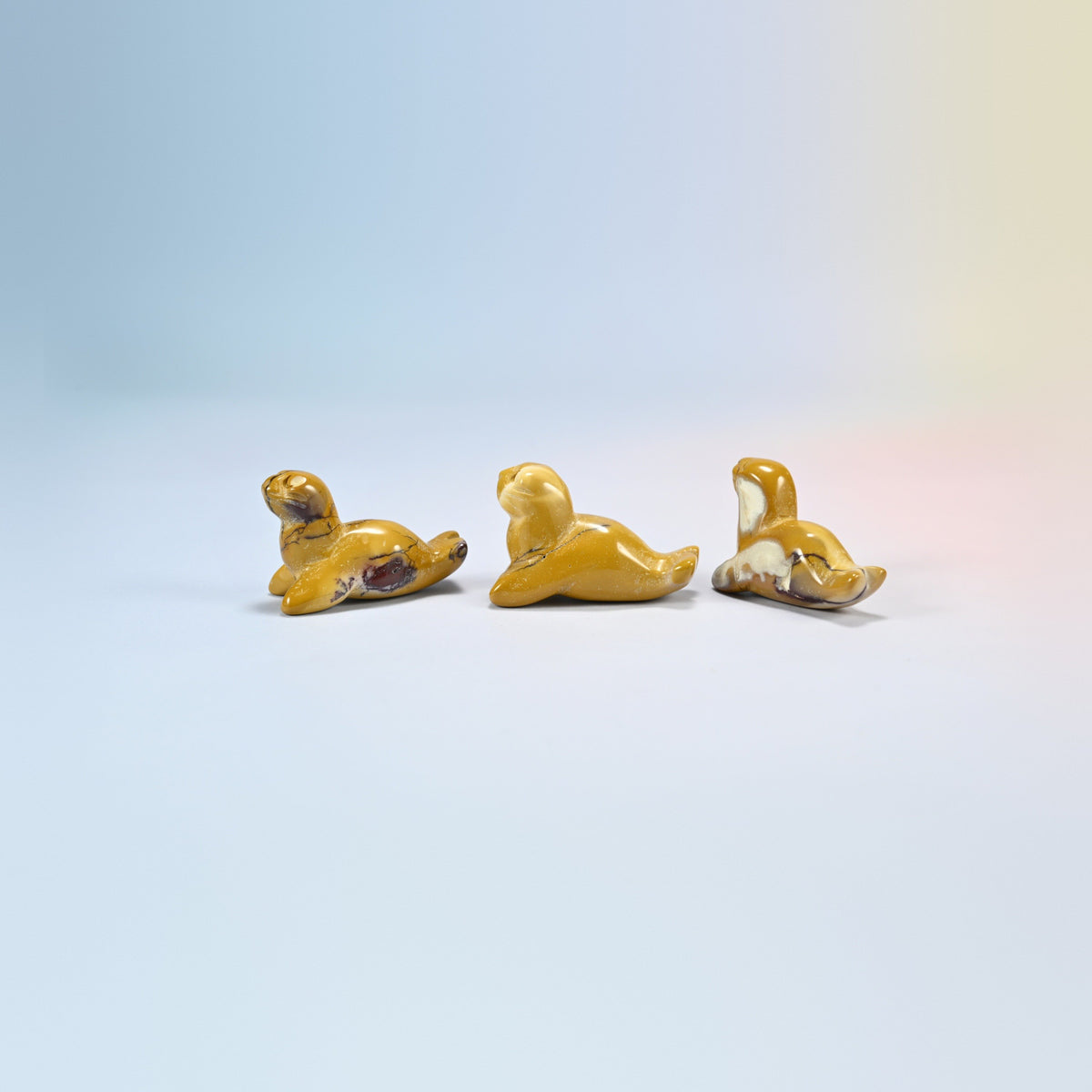 Three mookaite sea lion crystal carvings, 1.5 inch, golden yellow and red natural stone