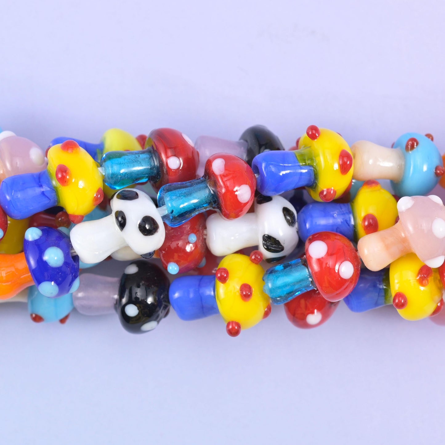 Mushroom shaped glass beads with a glossy glazed finish