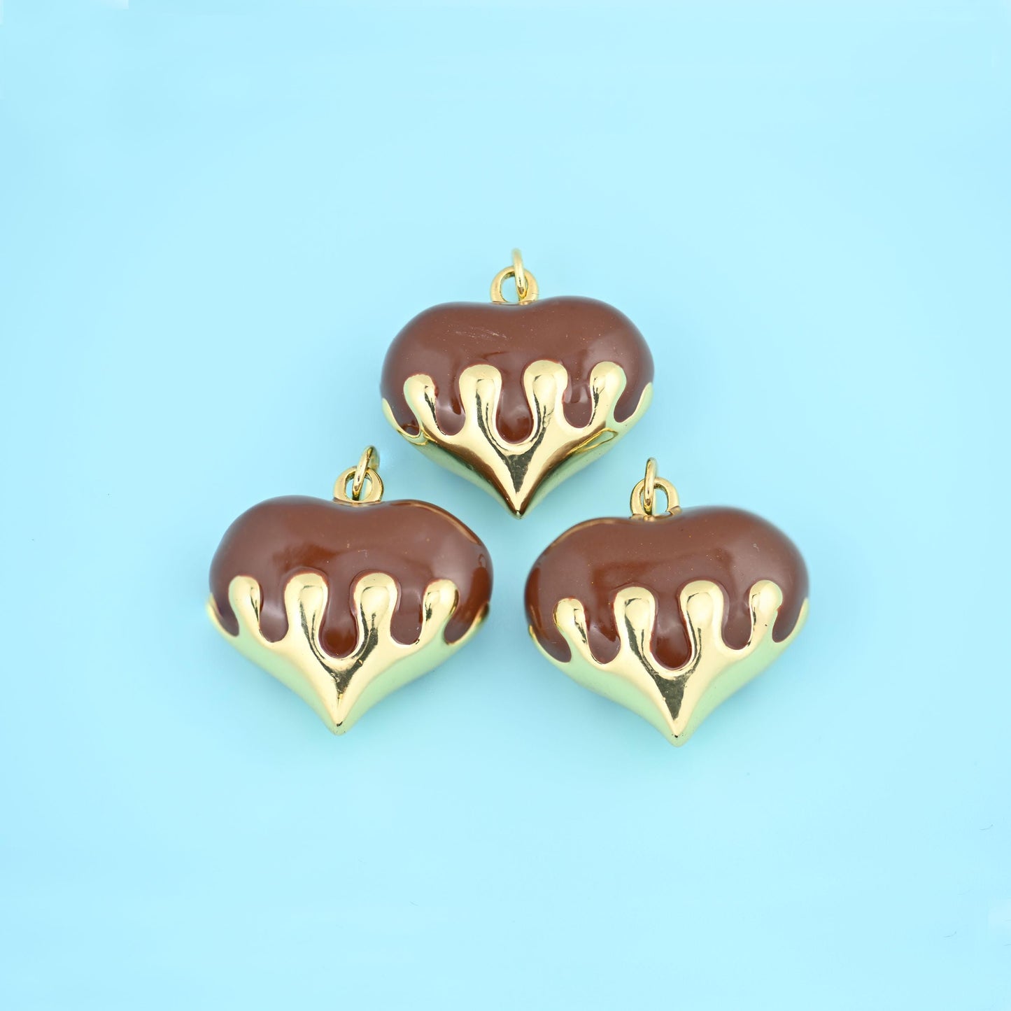 Puffy heart with a gold drip finish cut brass beads