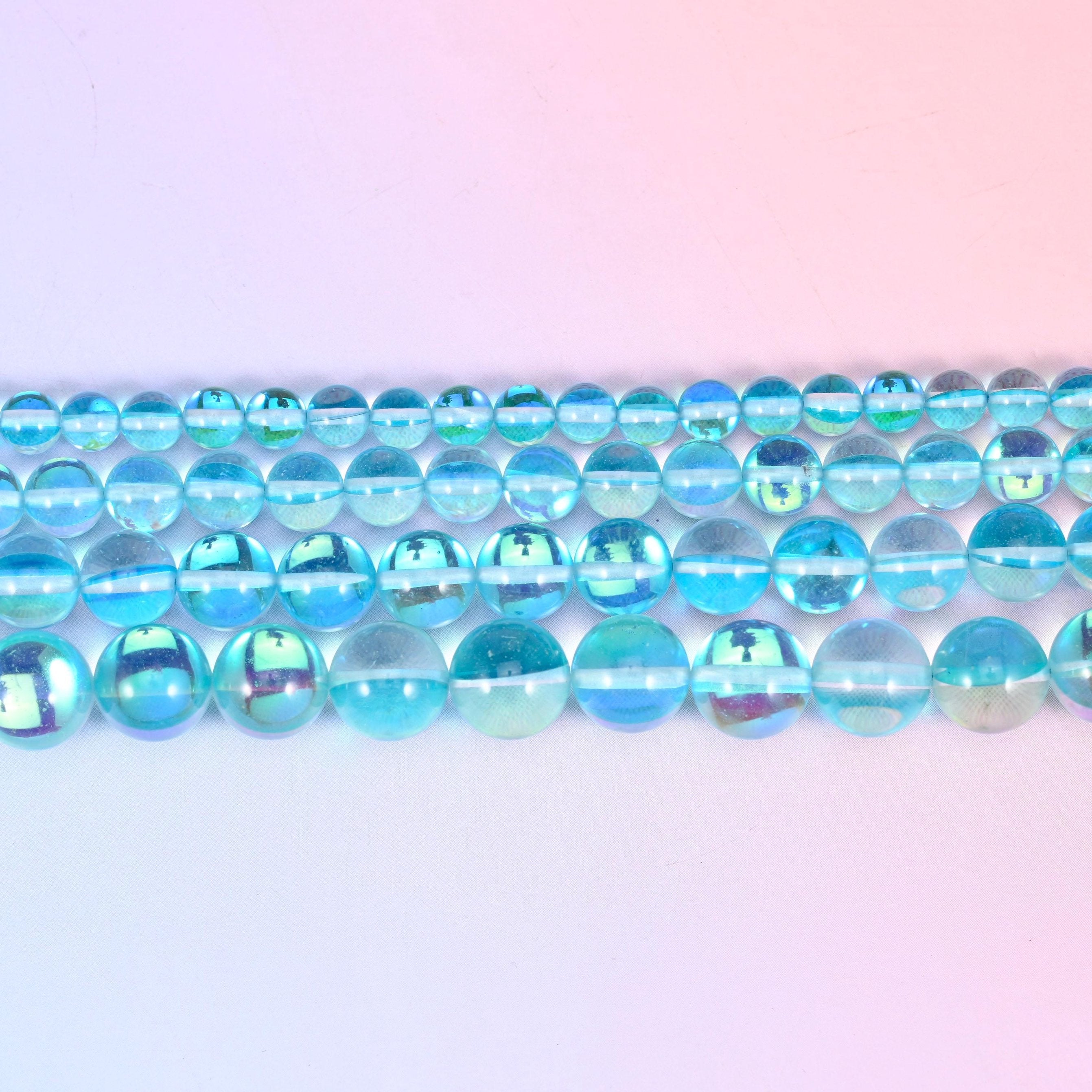 Iridescent Light Blue Round Glass Beads in clear aqua and sky blue with a green-blue rainbow flash