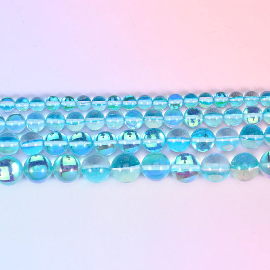 Iridescent Light Blue Round Glass Beads in clear aqua and sky blue with a green-blue rainbow flash