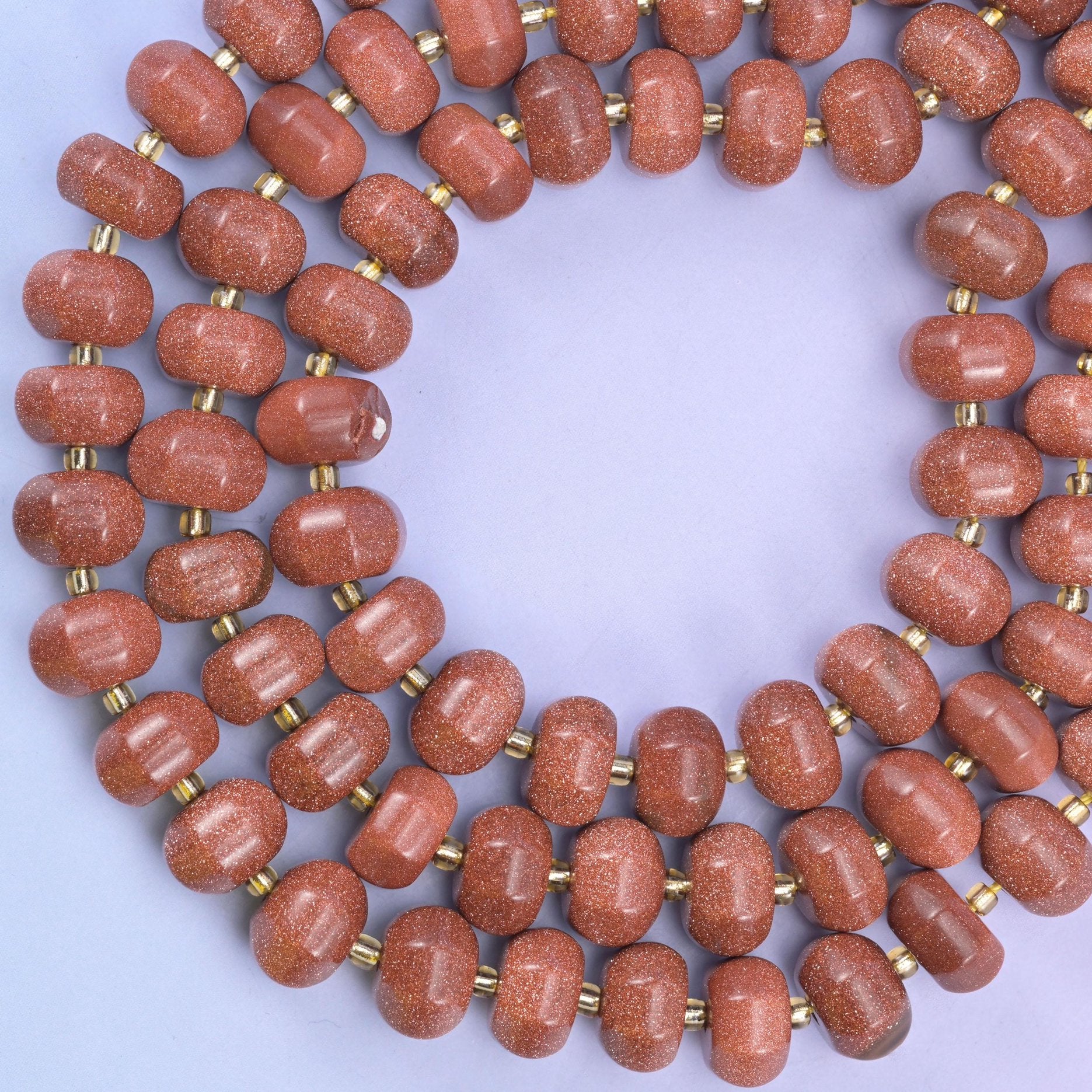 Gold sandstone pumpkin beads, approximately 35 beads per strand