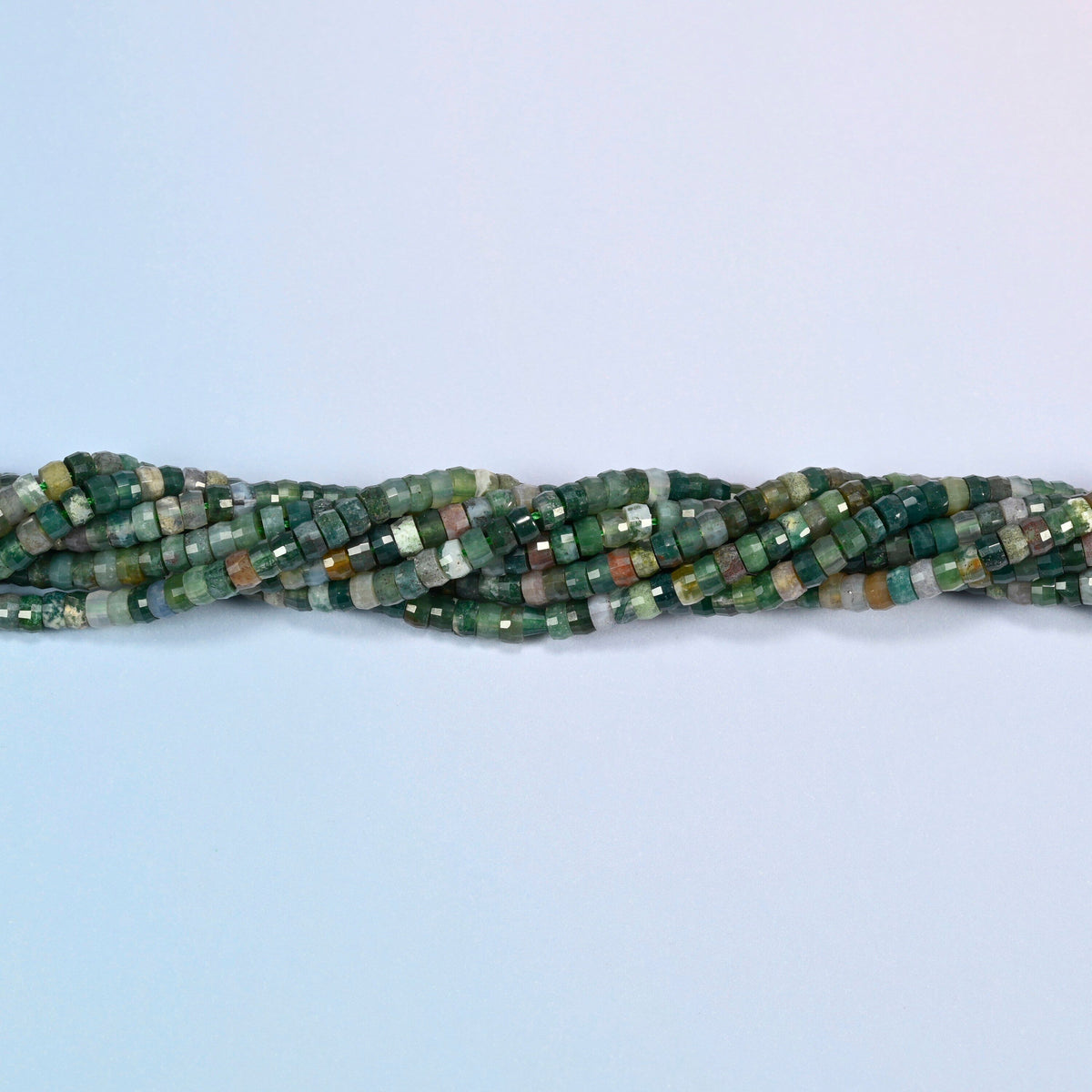 Strands of Indian agate faceted heishi disc beads twisted together in a horizontal row