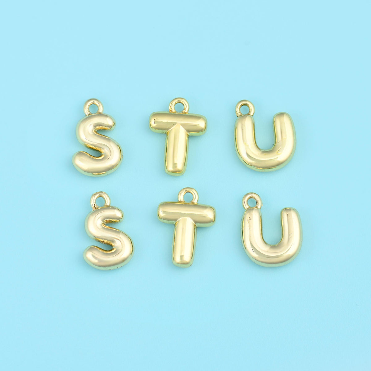 18K gold plated letter pendants S, T and U in rounded puffed gold.