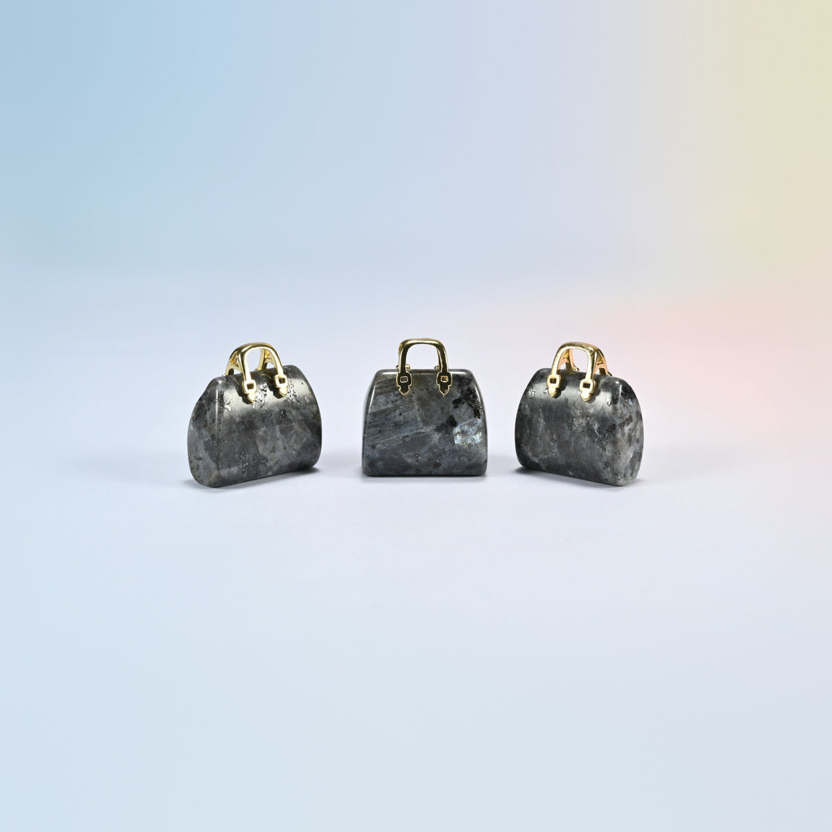 Three black labradorite purse crystal carvings, 1 inch, dark gray natural stone with light flecks, gold-tone handle