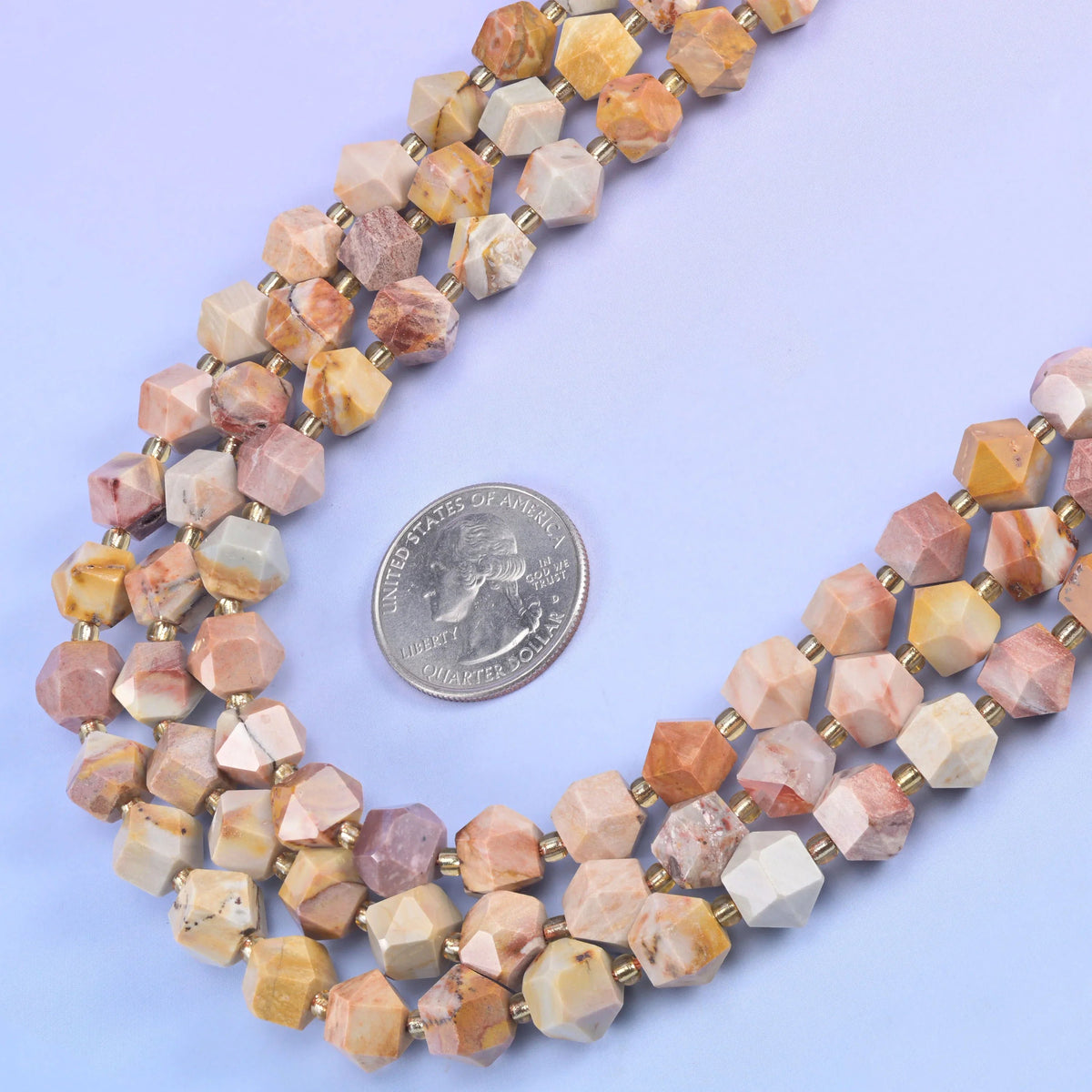 10mm faceted diamond cut beads that read as a small rhombus rather than a round.