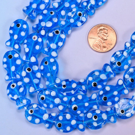 Moulded fish shaped transparent blue glass beads