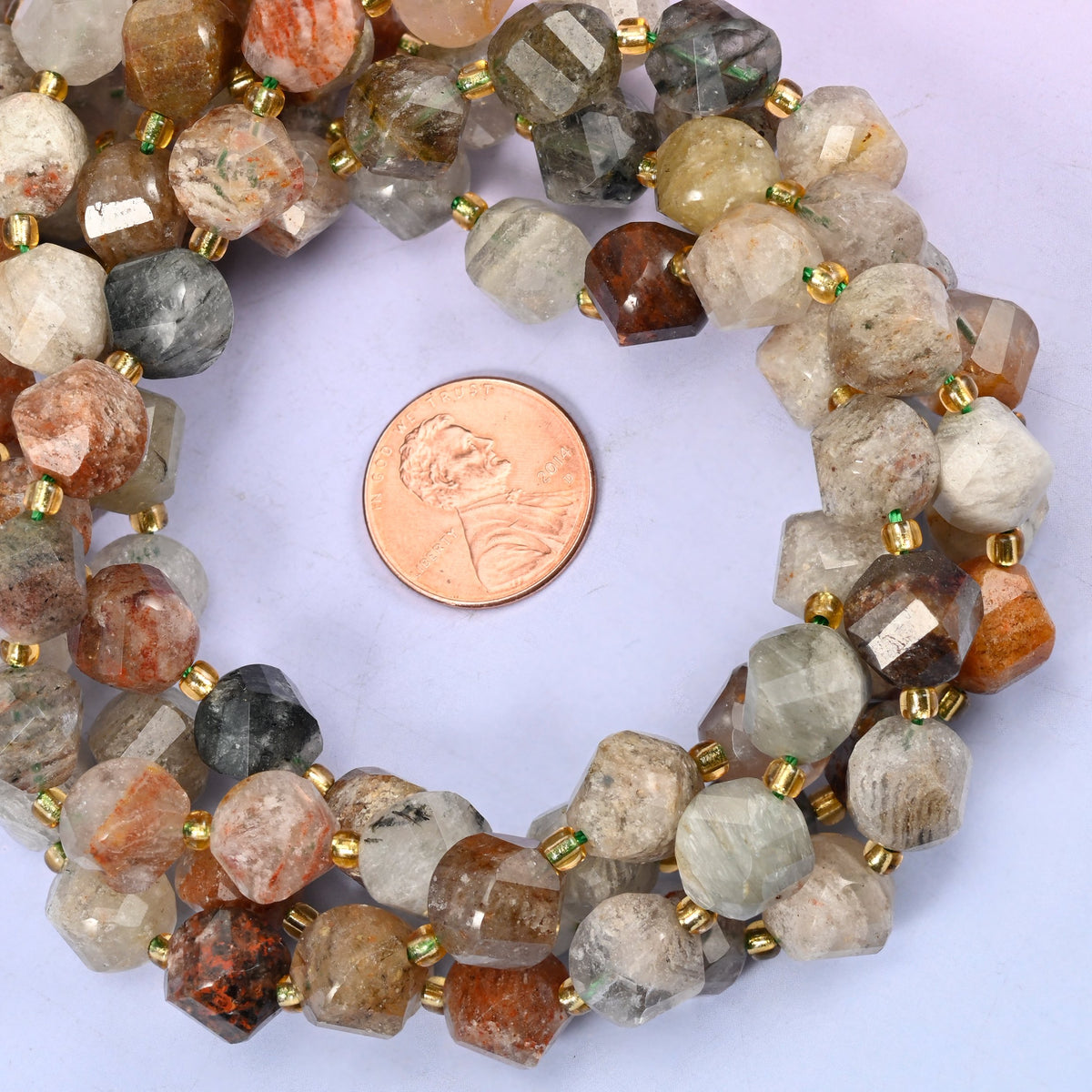 Thousand Layer Phantom Quartz natural crystal beads, 10mm spiral twist beads with colour variation from bead to bead