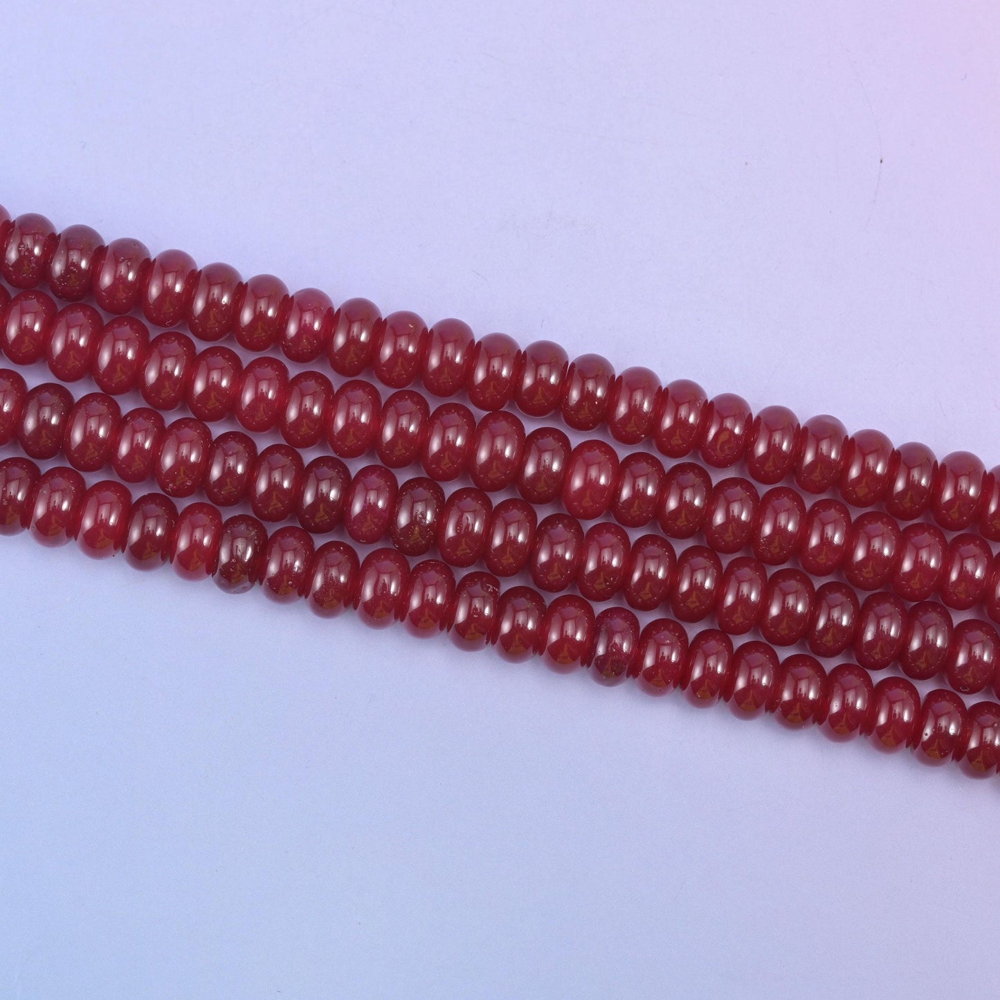 Ruby Red Dyed Jade beads in a deep, glossy wine-red tone