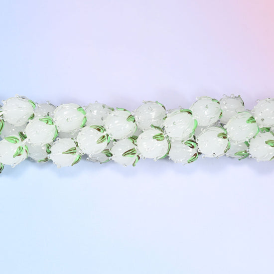 White tulip bud-shaped lampwork glass beads, frosted translucent glass with hand-formed sculpted petal detailing that gives a realistic flower bud look.