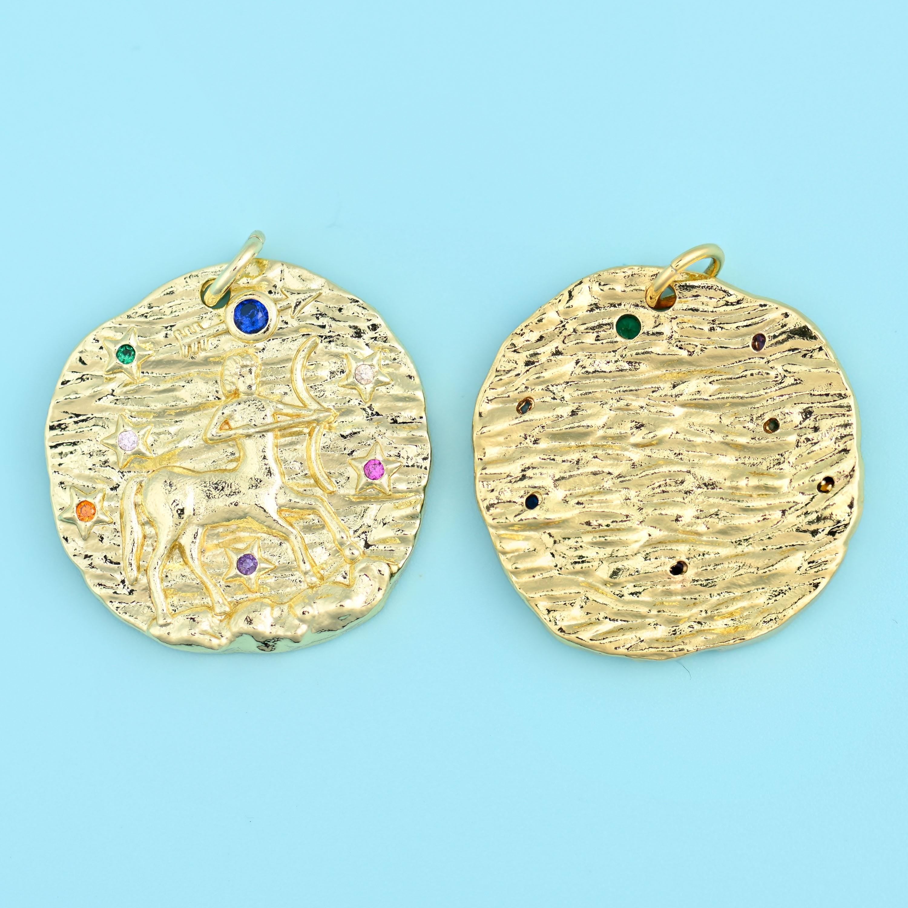 18K gold plated zodiac pendant with a horned bull motif, front and back, hammered gold finish