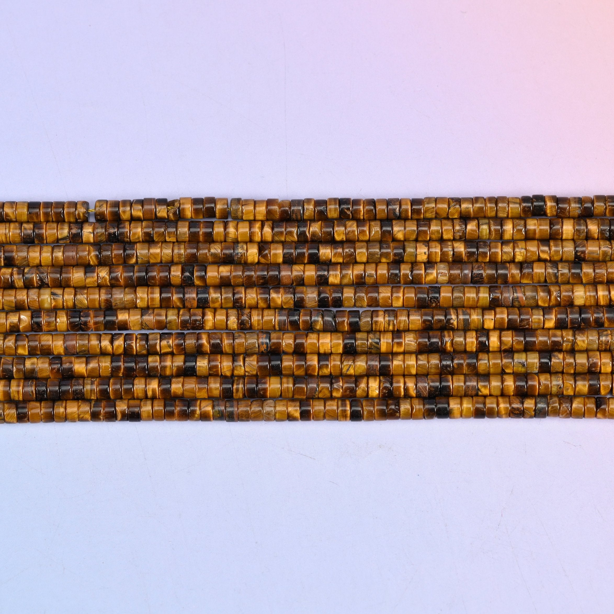 Tiger Eye Smooth Heishi Disc Beads in warm golden brown
