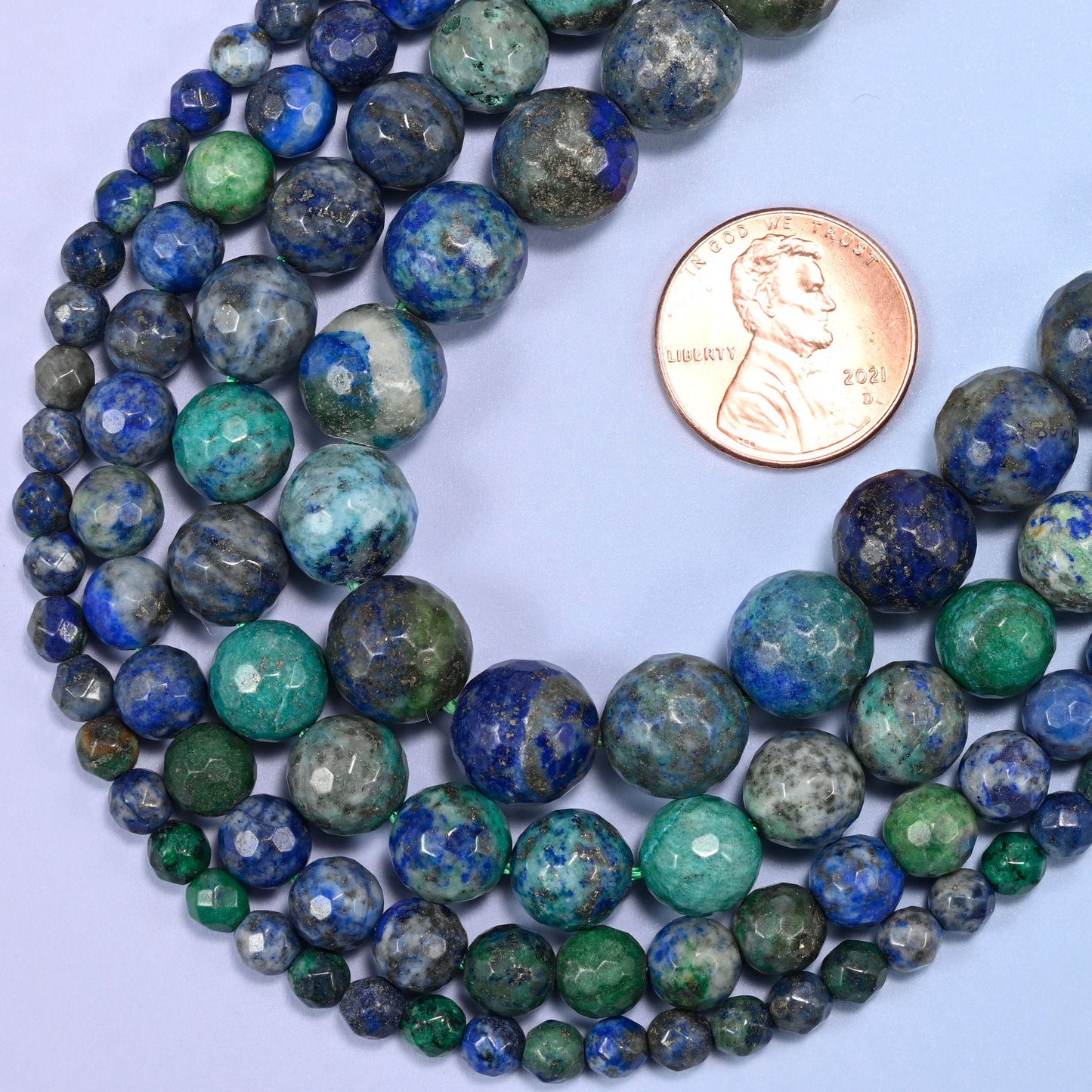 Faceted round cut phoenix lapis beads