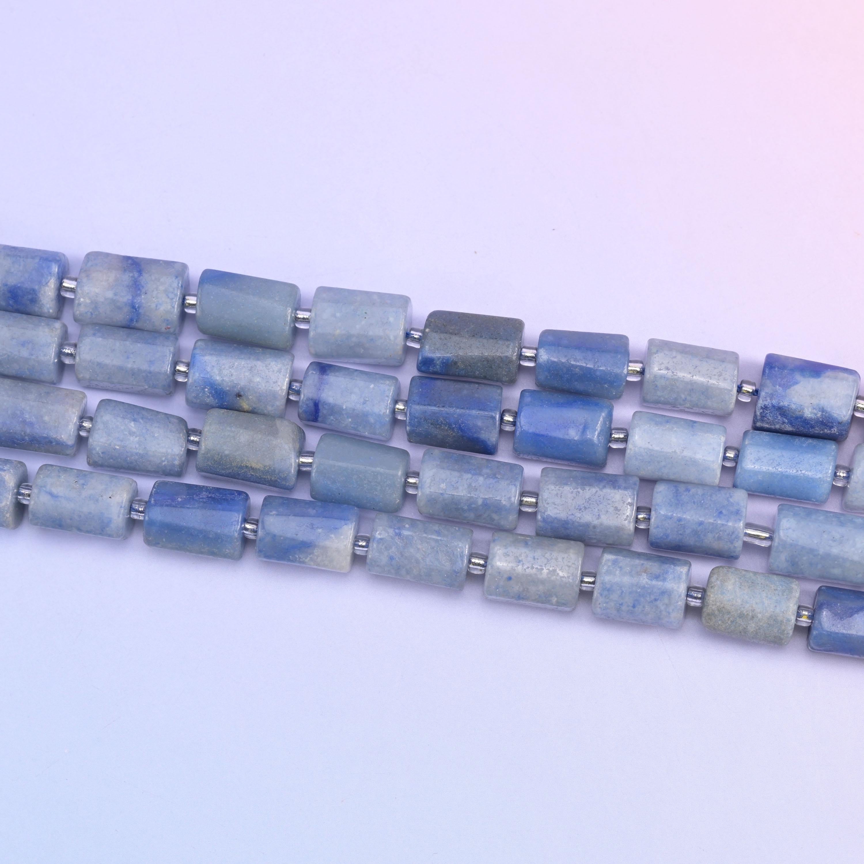 Strands of 12x8mm aventurine tubes laid diagonally, silver spacers between every bead
