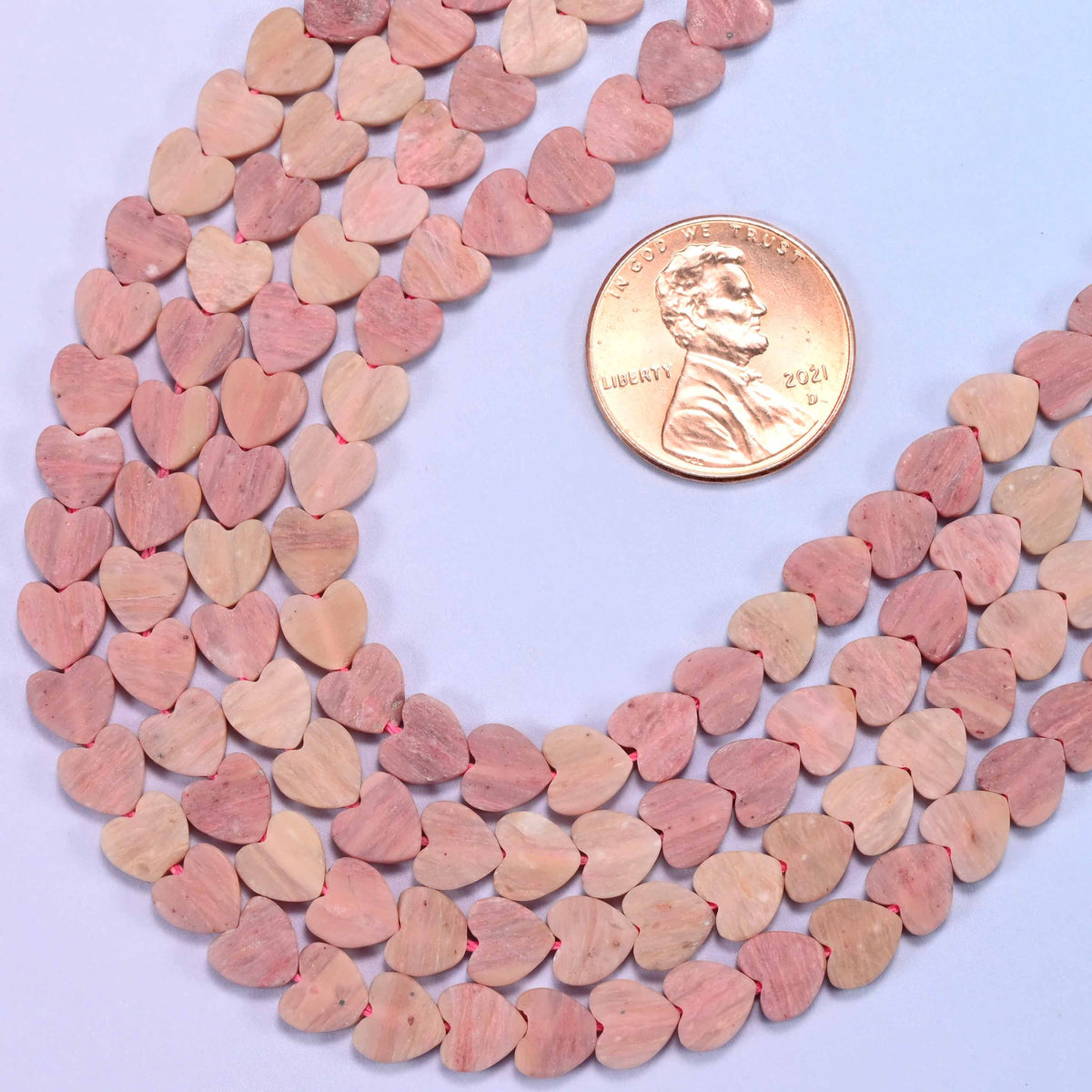 Flat heart cut pink rhodonite beads