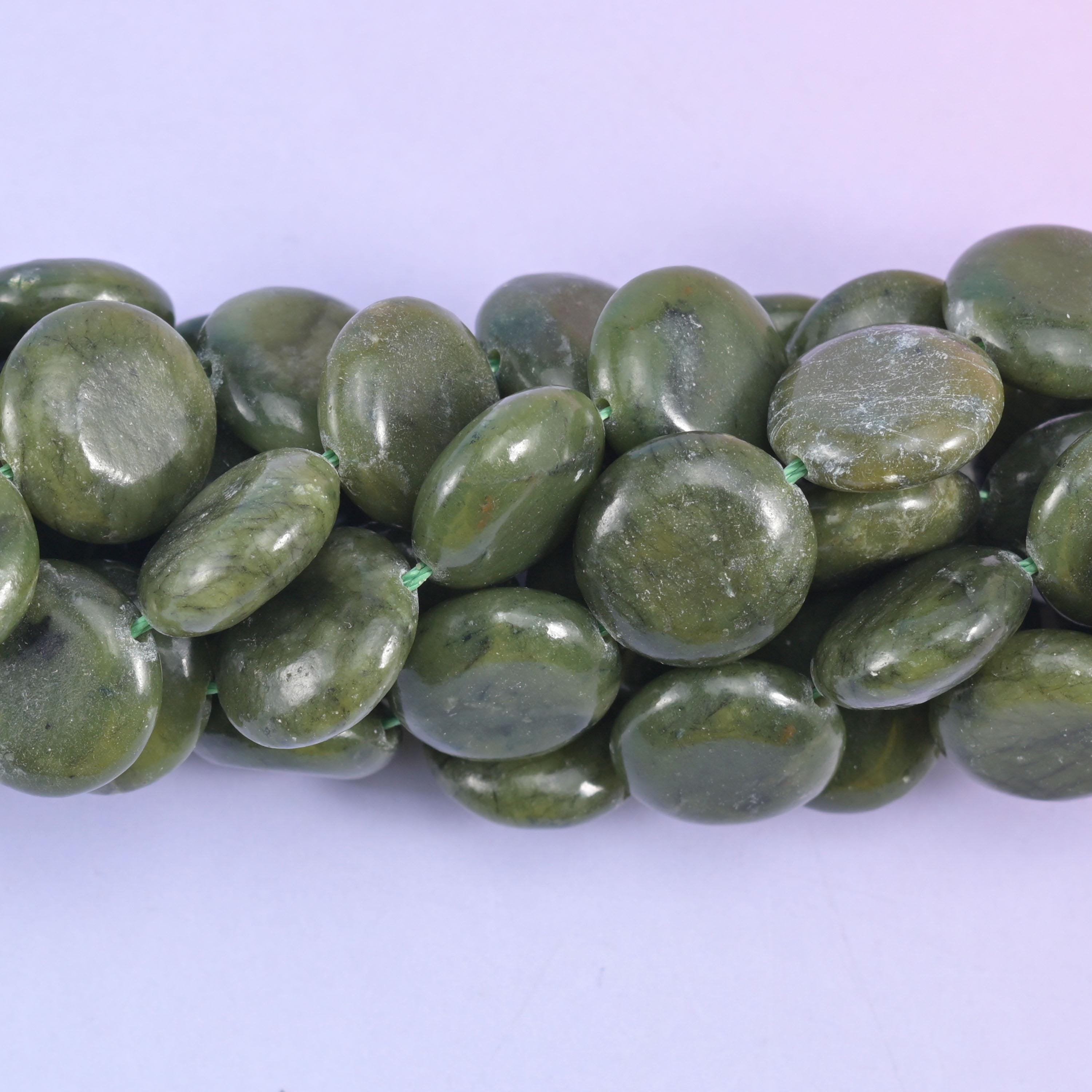 Coin cut South Green Jade beads with a smooth polished finish