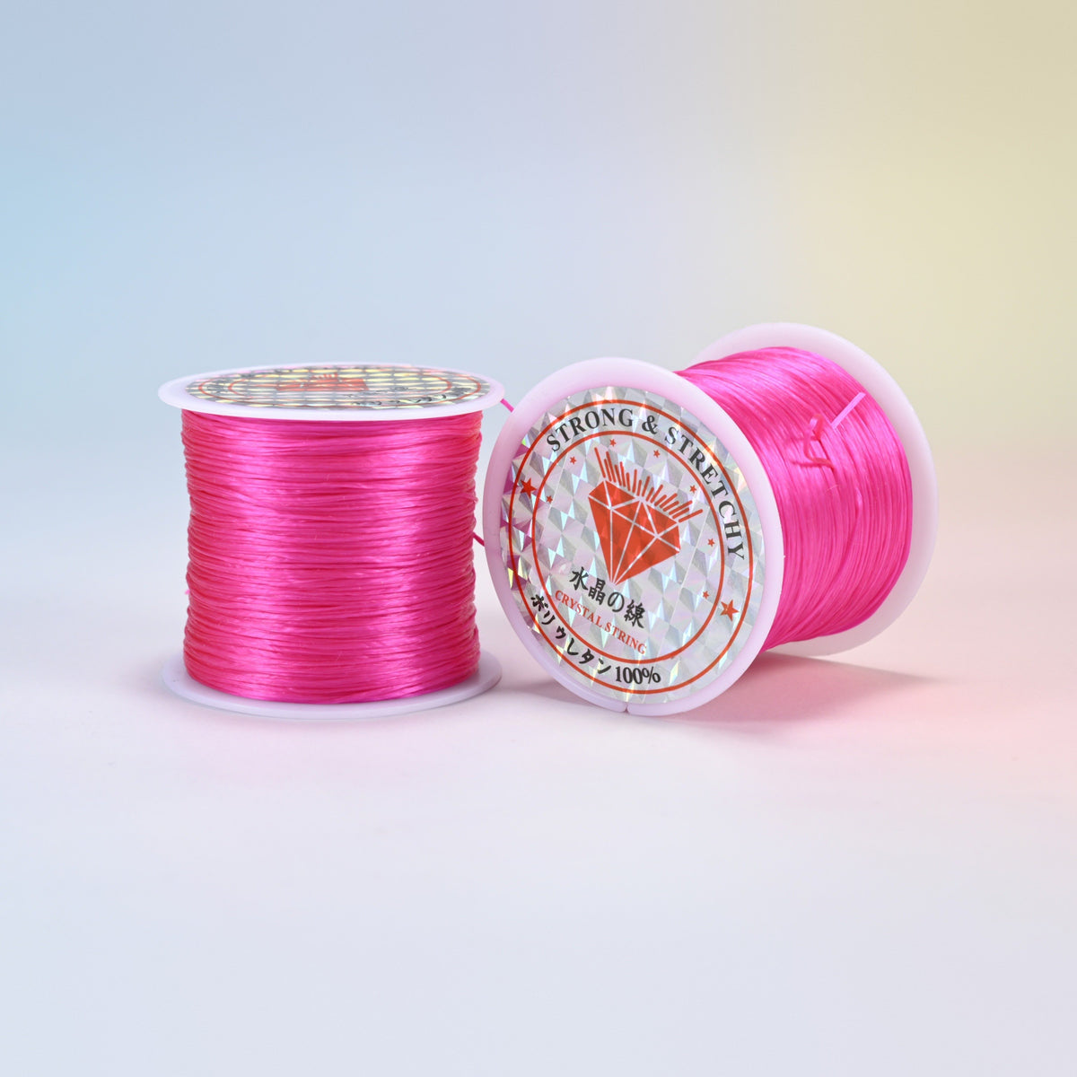 Two rolls of dark pink 0.7-0.8mm elastic stretch string, glossy polyurethane bead cord with a holographic label