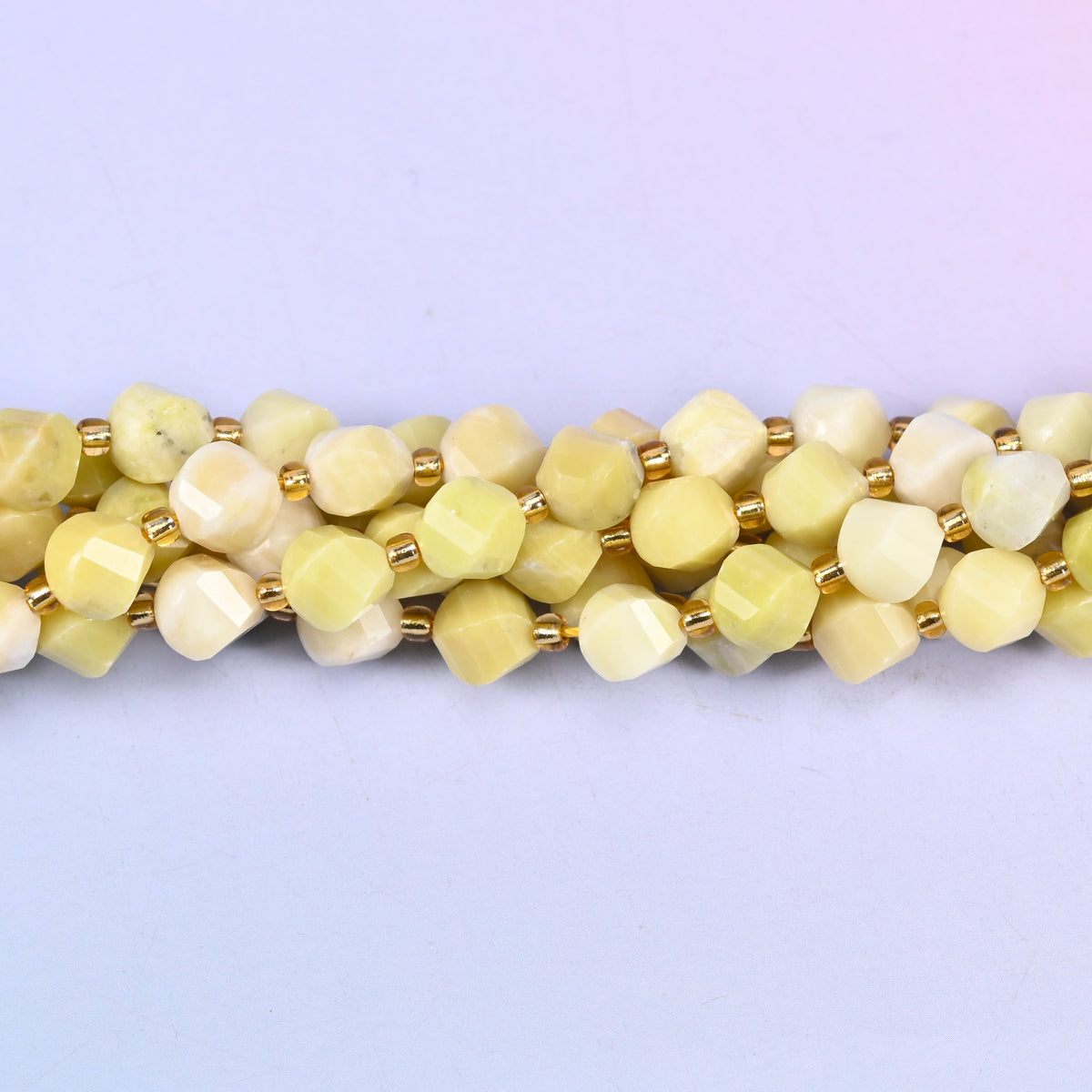 Lemon Jade yellow jade beads used as spacer or focal beads in handmade jewelry designs, 8mm