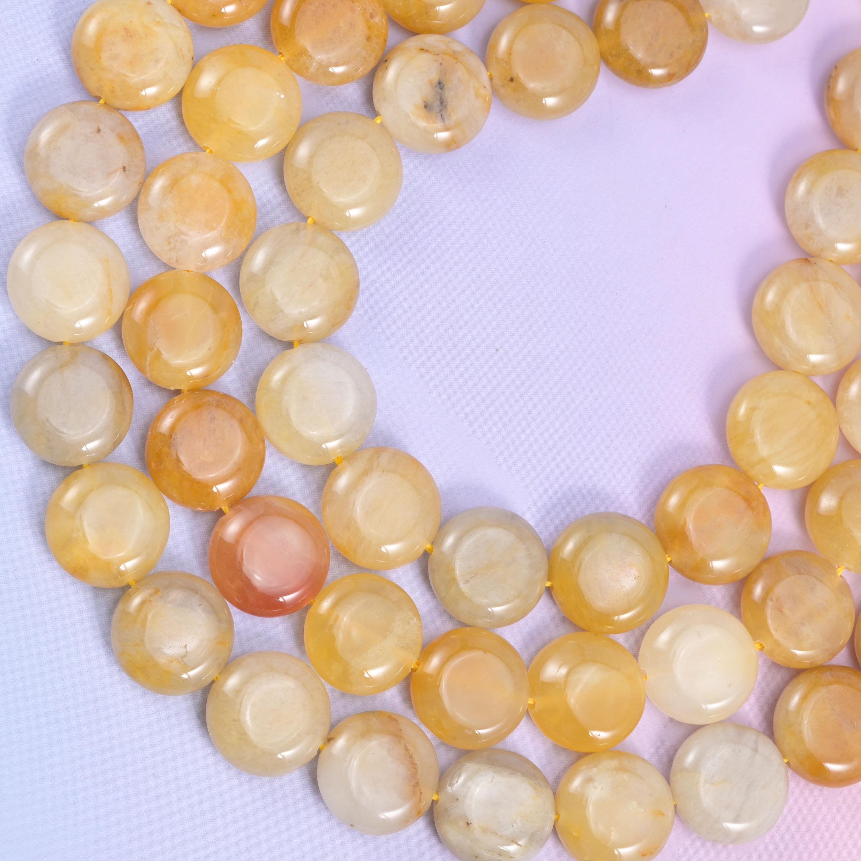 Yellow Jade coin beads, approximately 26 beads per strand